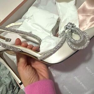 Satin white heals with silver details. Gorgeous heals.